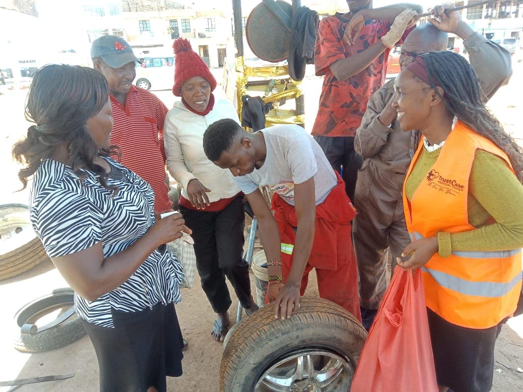 Afya Mashinani Hub team members standing together outside a building